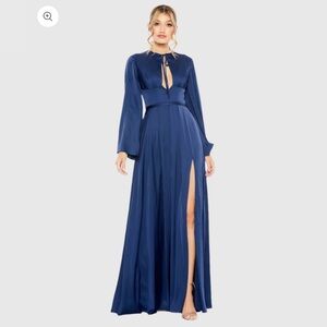 Mac Duggal 
Charmeuse fabric (100% polyester) 
Fully lined 
Long bell sleeve